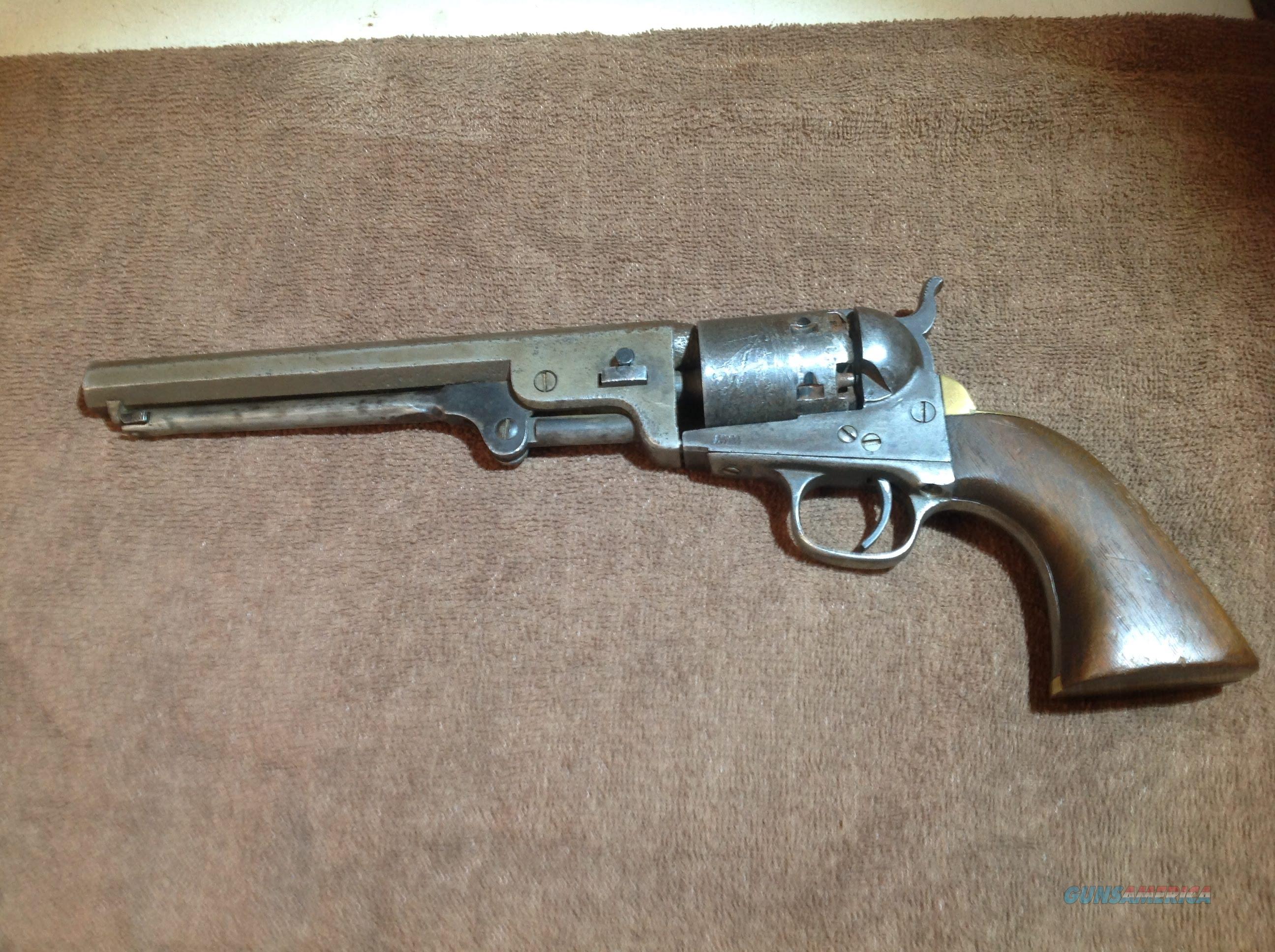 Colt Mod. 1851 Navy,engraved,silver plating,cased,postwar,cal..36,no.  16337. Matching numbers. Octagonal barrel,bright bore,length 7-1/2. Six  shots. Manufactured in 1975. Firm address on barrel,on frame marked Colts  Patent. On cylinder roll