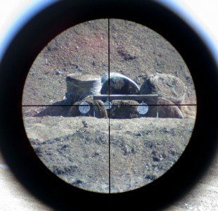 Burris C4Plus Wind MOA Reticle – This is a through the scope shot looking down range at Independence Range’s 300 yard steel targets.  I would not judge the image quality of the Burris scopes based on this picture but the edge to edge clarity was very good.  The reticle also contrasted well with the background making it and the hash marks easy to pick up and index on target.  In this case, the picture imitates holding 1 MOA right on the center target to compensate for a stiff right to left wind.