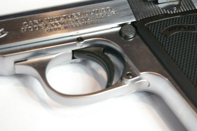 Pull down on the guard for disassembly