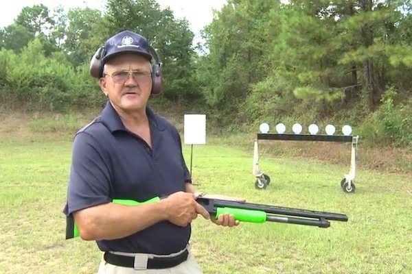 Miculek trick shooting with Mossberg 500