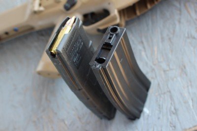 There's no mistaking the magazine. A loaded AR mag won't seat inside the Airsoft mag well. 