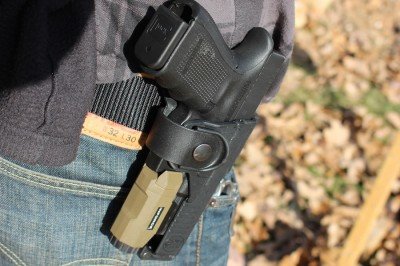 The Fobus Tactical holster has a wide cut out on the back side which leaves the rail on this GLOCK 19 open.  You can wear any light or laser that will fit on this rail.