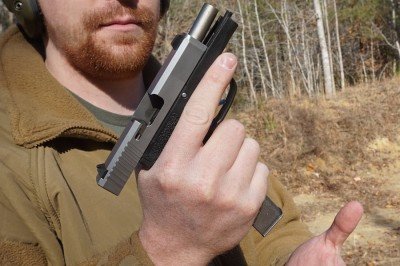 The grip is long enough that the mag won't catch on your palm when you hit the button.