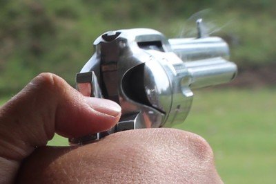 Cock with your left hand, shoot with your right. Note the transfer bar covering the pin.