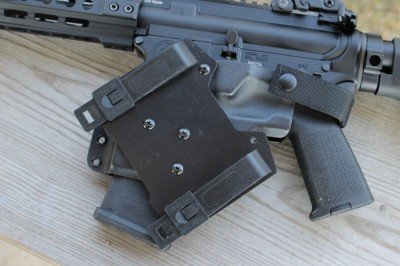 The mount allows for attaching the holster to MOLLEE or to a belt.