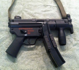 MP5 K Gun with Navy Lower. Factory HK device to attach 2 magazines shown. Factory down front grip to control rise.