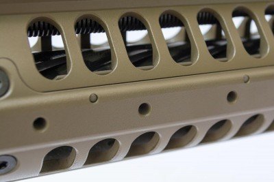 Pre-threaded holes in the hand guard allow attachment of picatinny rail segments only where you want them.