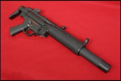 MP5 SD shown with factory collapsible stock. Suppressor screws onto barrel that has slots cut into it this allows all 9mm fired to be subsonic. 