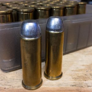 These .44 Magnum reloads headspace on the rim so they can use a roll crimp. Note how the case mouth "rolls" into the bullet groove (cannelure.)