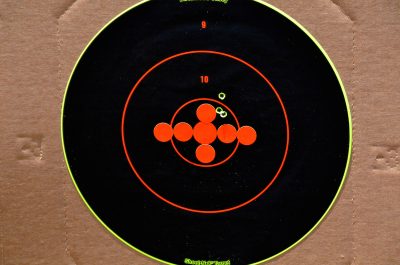 The author was able to get this group at 100 yards with iron sights. The group could be covered with a quarter. 