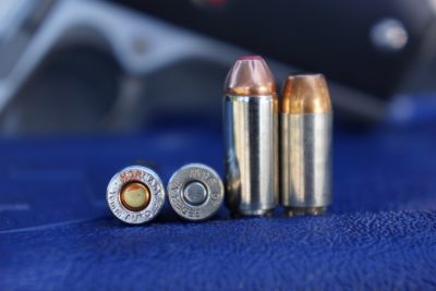 The 10mm round (taller round, and far left) delivers a good deal more power than the .40 S&W round (next to it).