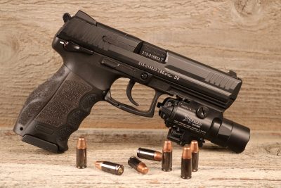 The HK P30L has a standard Picatinny rail molded into its dustcover. Shown equipped with a Surefire X-400.