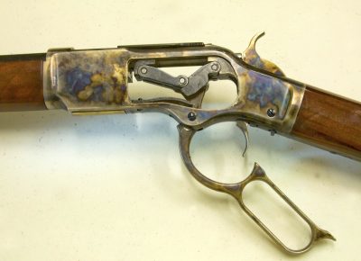 Toggle-link action open, with sideplate of the rifle removed. Note the attractive finish on the receiver. 