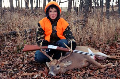 Sean Yackley with his Rossi Lever Action and his deer: food on the table and a sense of self-sufficiency are two benefits to hunting. 