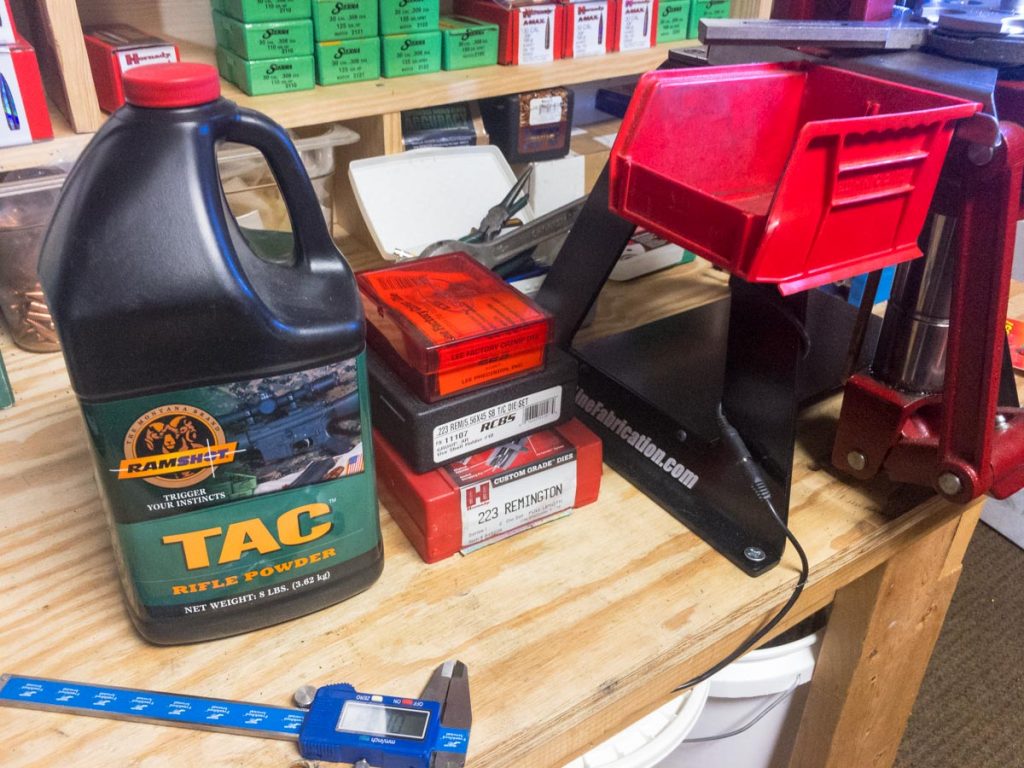 I always keep only one powder container on my loading bench and that's the one currently being loaded. I don't want to risk using the wrong powder.