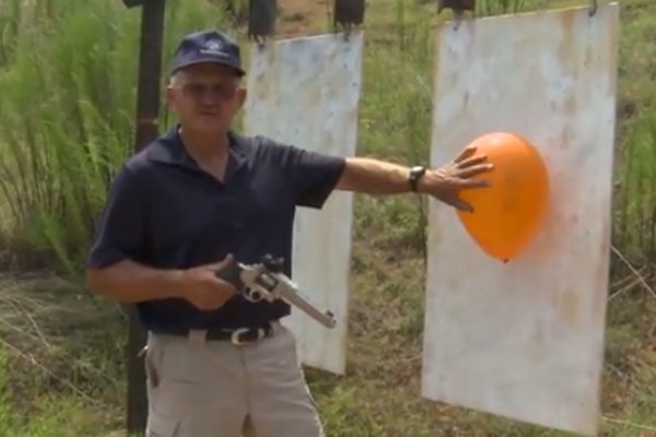 Miculek pops balloon at 1000 yards, with 9mm revolver