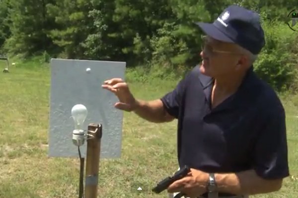 Miculek lightbulb trick shot with M&P22 Compact