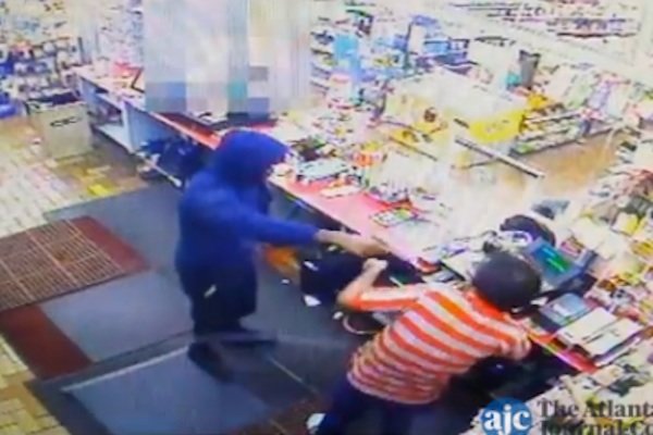 Clerk shot in head, despite handing over cash