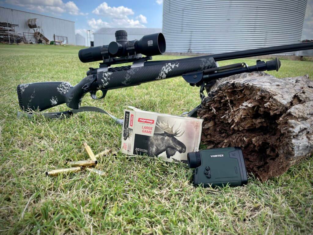 Weatherby Ultralight Mark V Backcountry 2.0 TI posed on a log