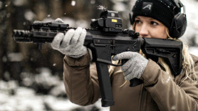 Woman with pistol caliber carbine