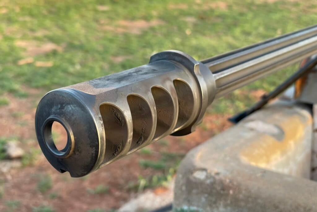 Cylindrical muzzle brake that works as the QDL suppressor host for the Barrett M107A1