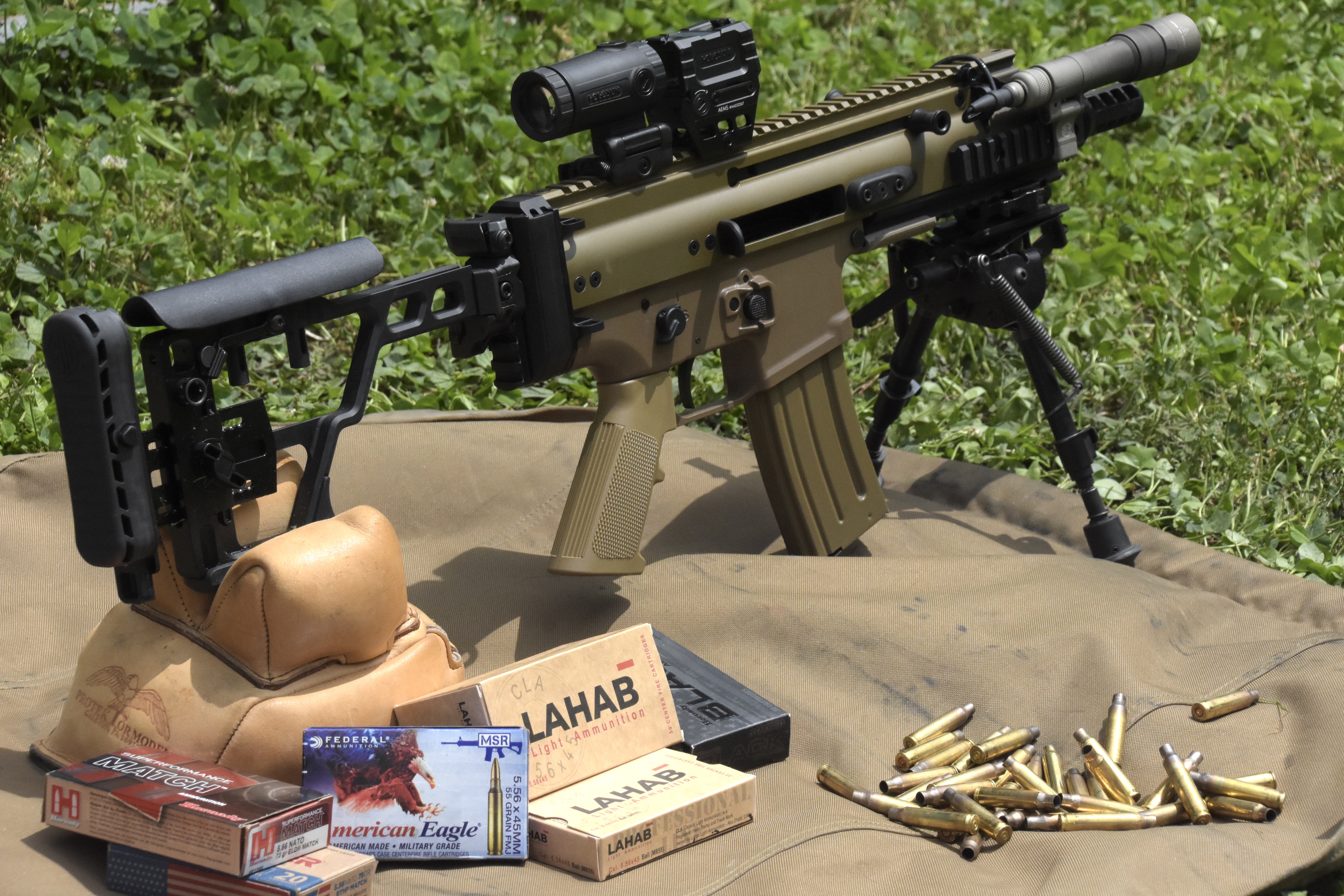 Shooting the Scar 15P at the range with a red dot and magnifier setup off of a bipod and rear bag. 