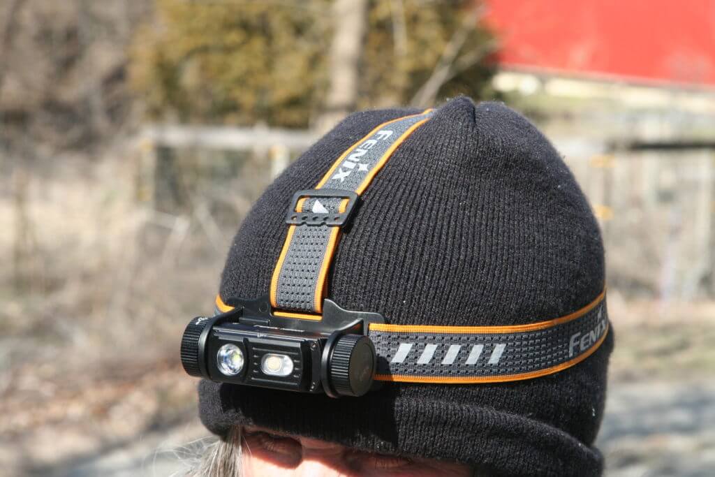 Woman wearing Fenix HM60R headlamp