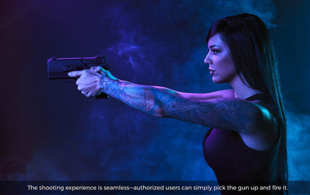 A woman holding a Biofire 9mm smart gun.