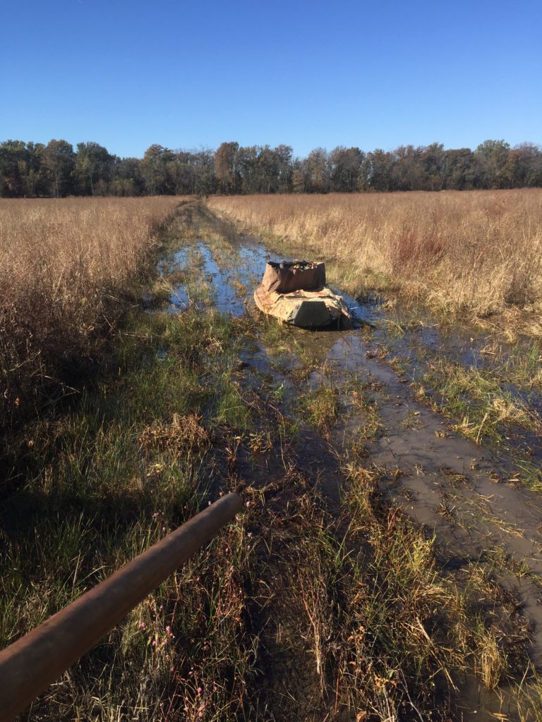 Gear boat sitting on muddy ground