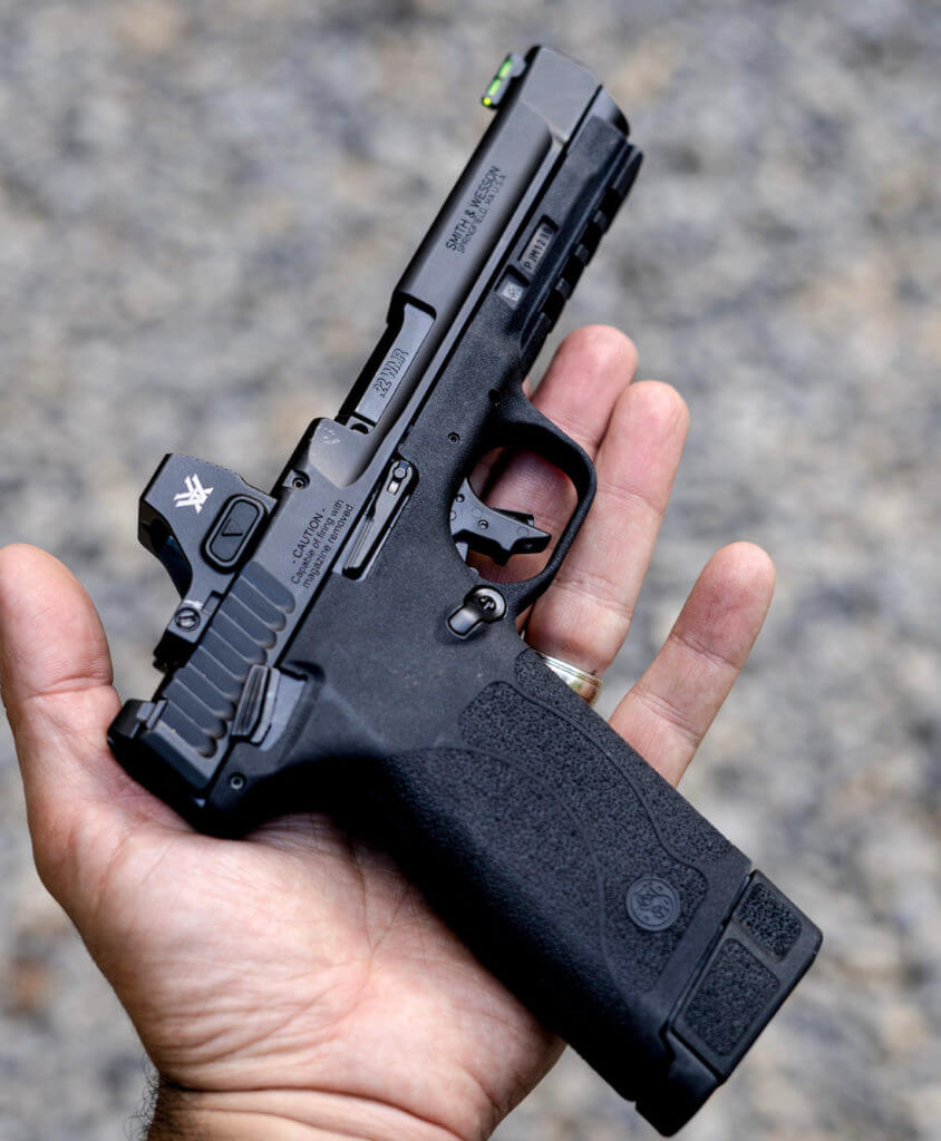 The M&P22 MAGNUM pistol in a hand.