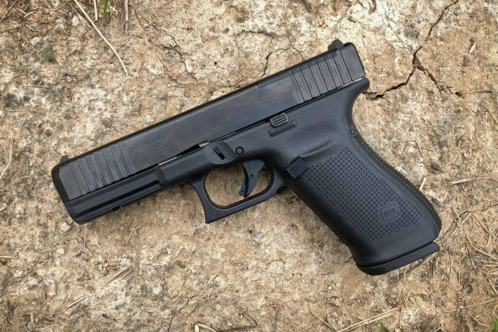 Glock 20 Gen5 MOS on dried ground
