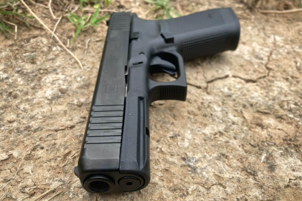 Glock 20 Gen5 MOS muzzle on dried ground