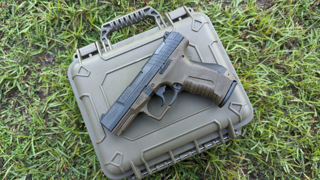 The Walther P99 Final Edition sitting on lock case in the grass