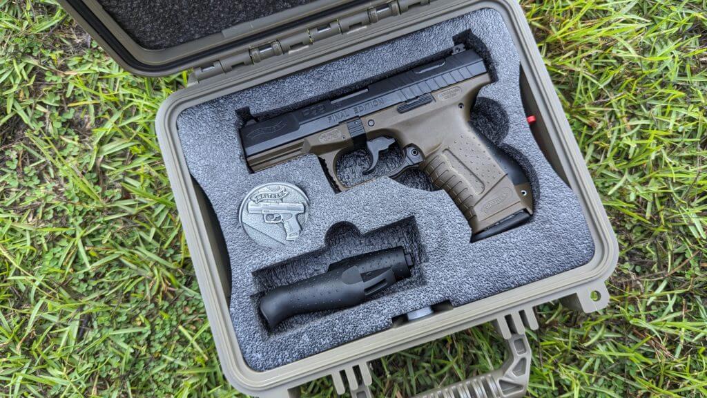 Walther's Final Edition and gear in case on the grass