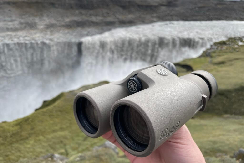 SIG SAUER ZULU8 HDX Binoculars in front of large waterfall