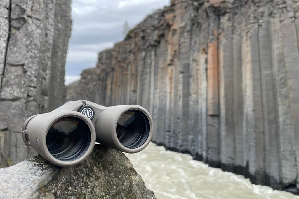 SIG SAUER ZULU8 HDX Binoculars sitting on rock in Icelandic lava rock canyon