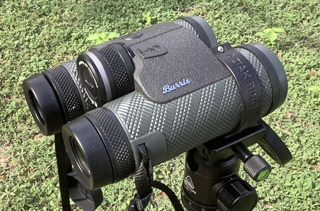 Binoculars on a tripod in the grass