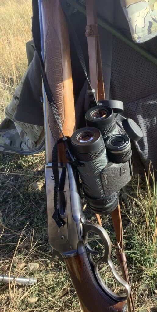 10x42 Burris LRF binoculars with wooden shotgun and camo hunting gear