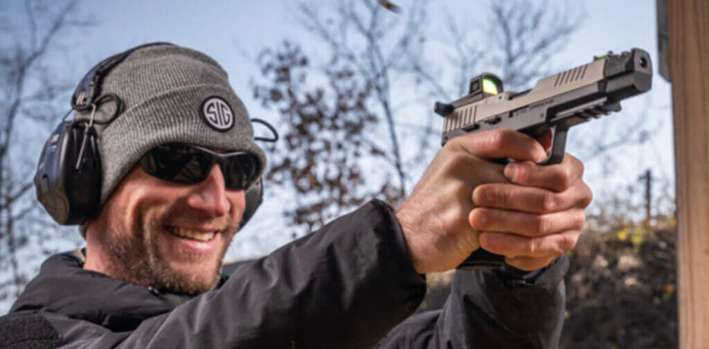 A man shoots the P322-COMP.