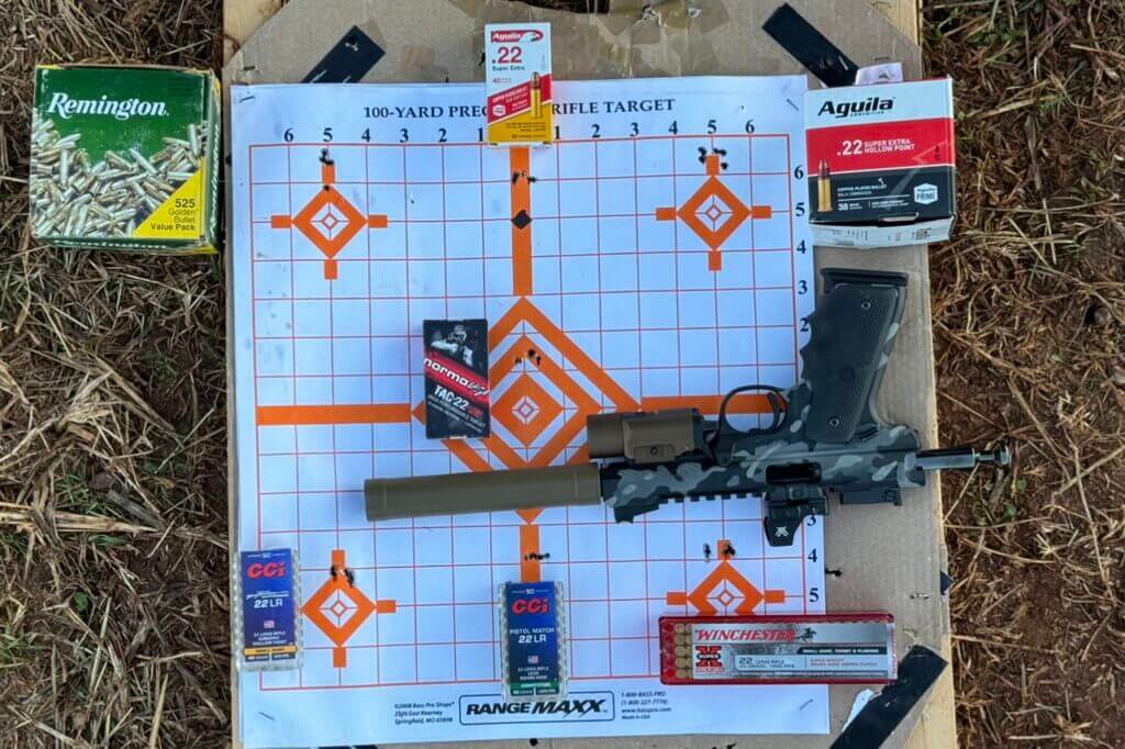 Each box of ammunition placed next its respective 5-round group shot from 10 yards