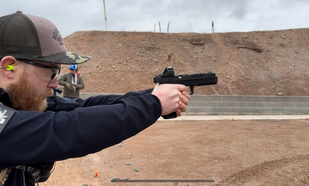 A man shoots the RIA 5.0E at the gun range.