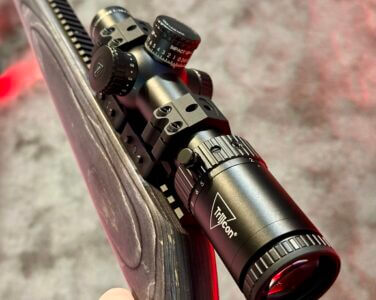 A closeup view of a rifle scope.