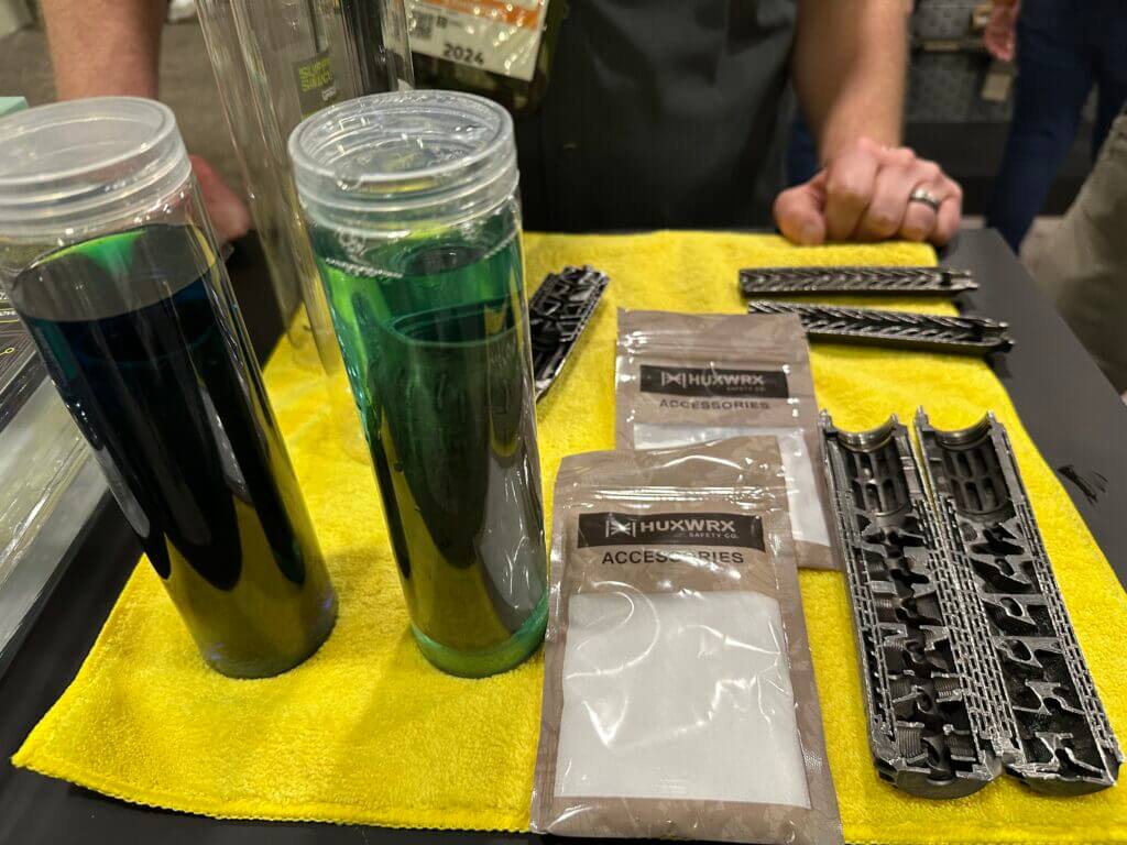 a table is covered in suppressor cleaning solution bottles and powder packets.