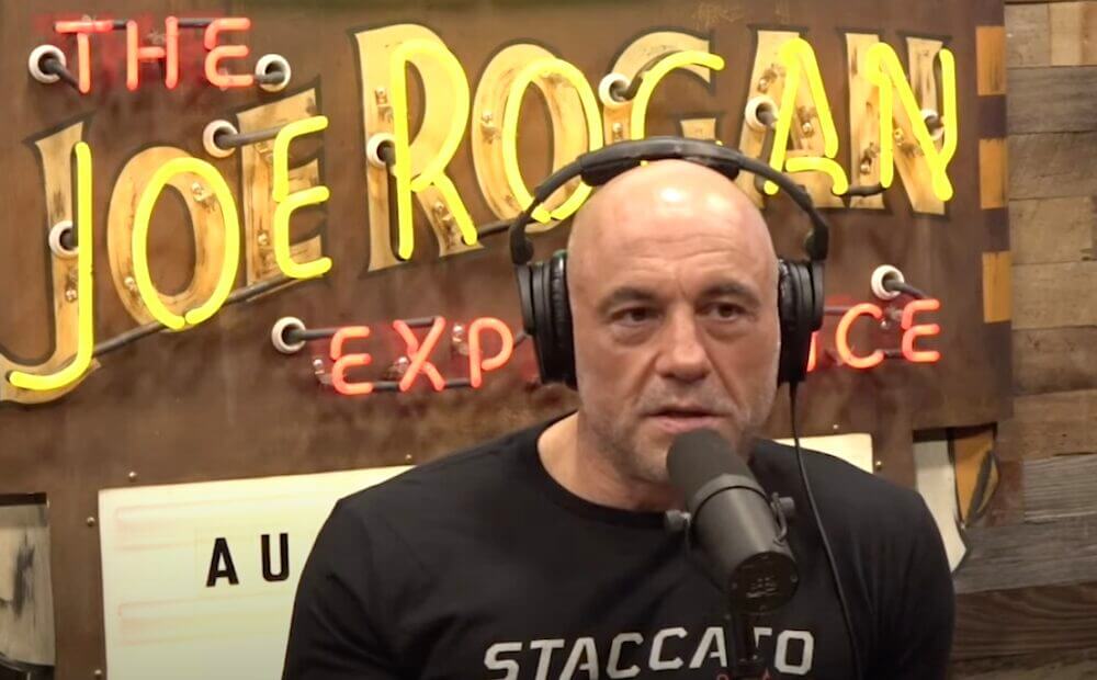 Joe Rogan on his show sitting down.