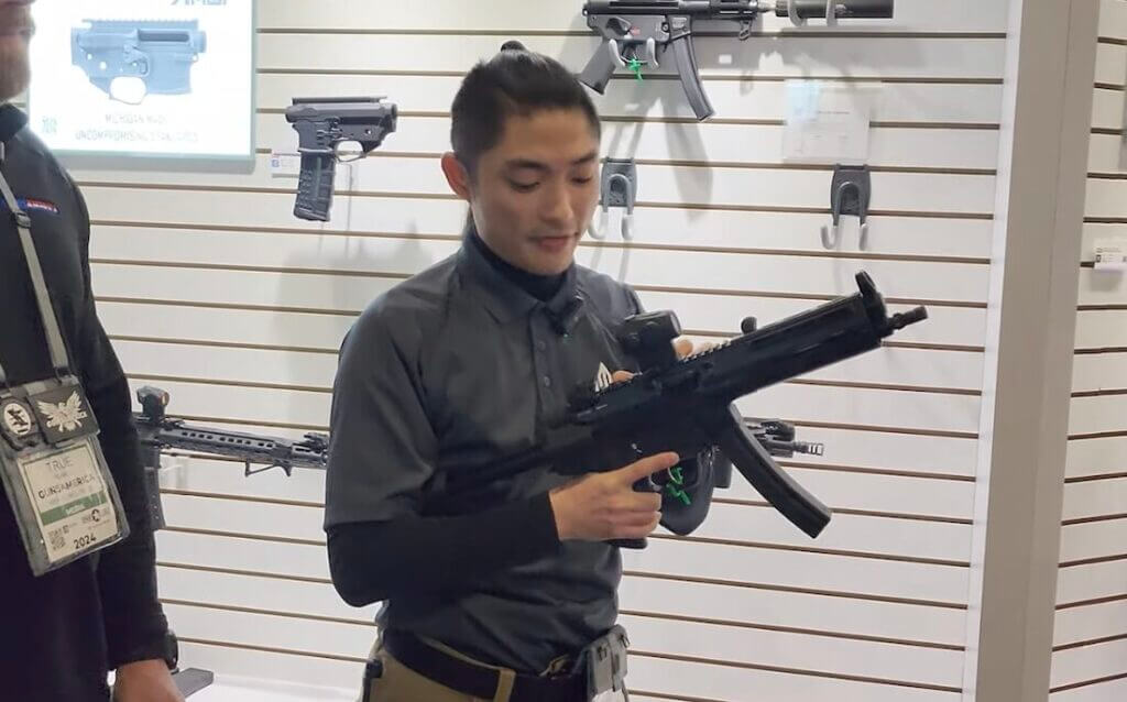 Kio from Leapers holding the handguard.