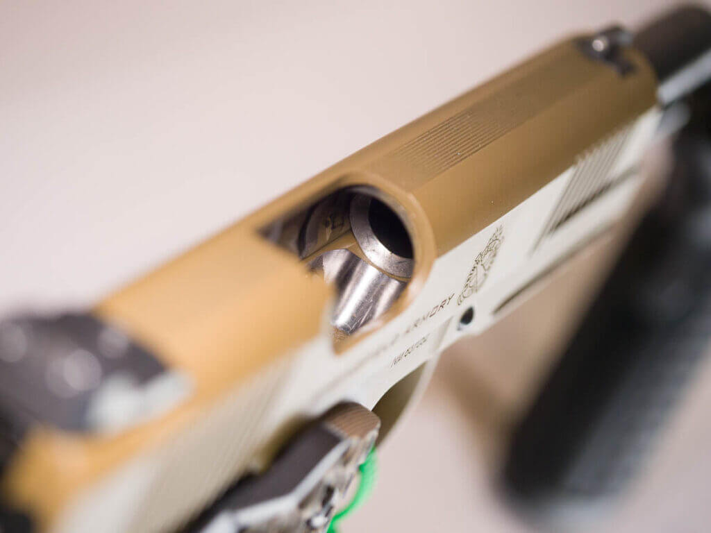 Close up view of the feed ramp inside the gun with the slide open.