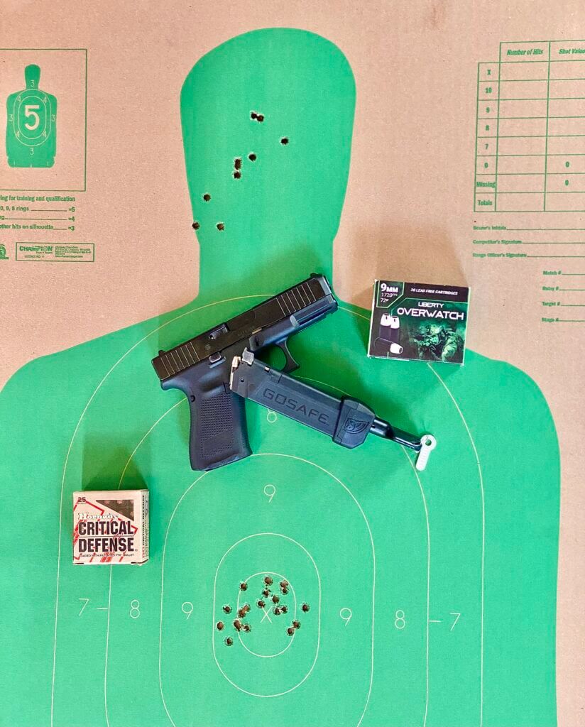 Glock 19 with GOSAFE Mobile Mag and ammo on a used green target