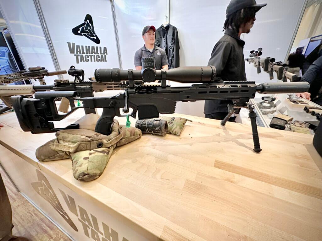 A rifle is displayed on a counter.