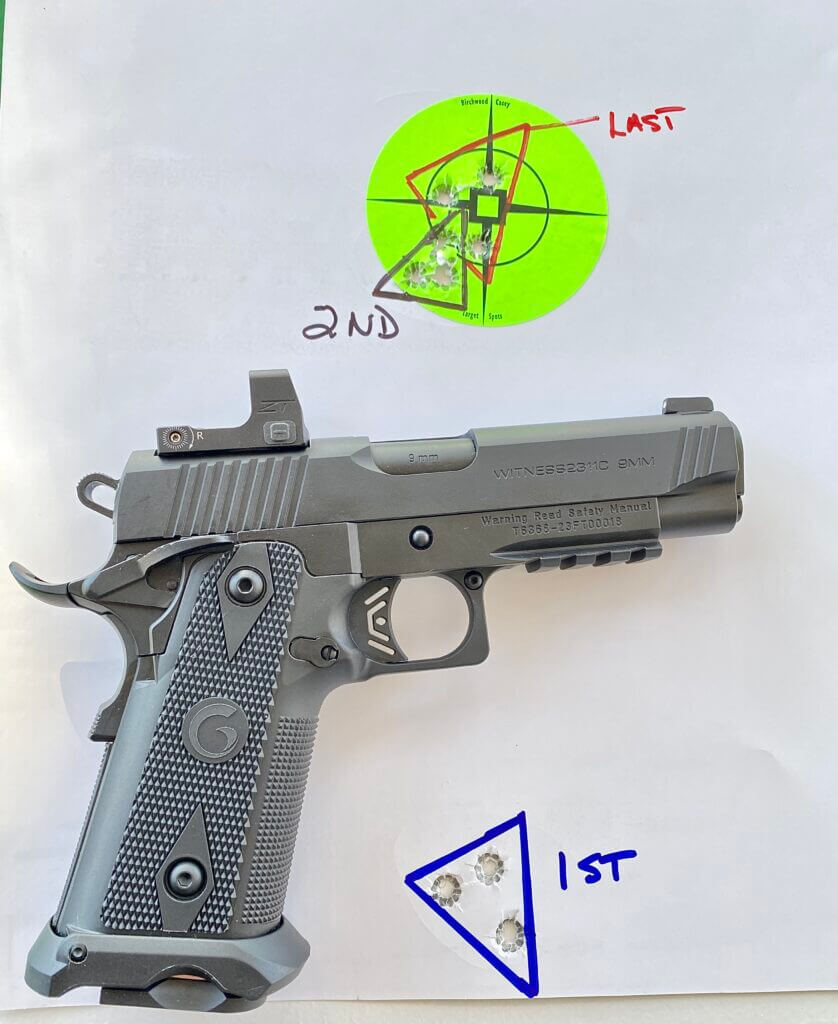 Thrive HD mounted to a Girsan Witness2311C 9mm in front of a used paper target