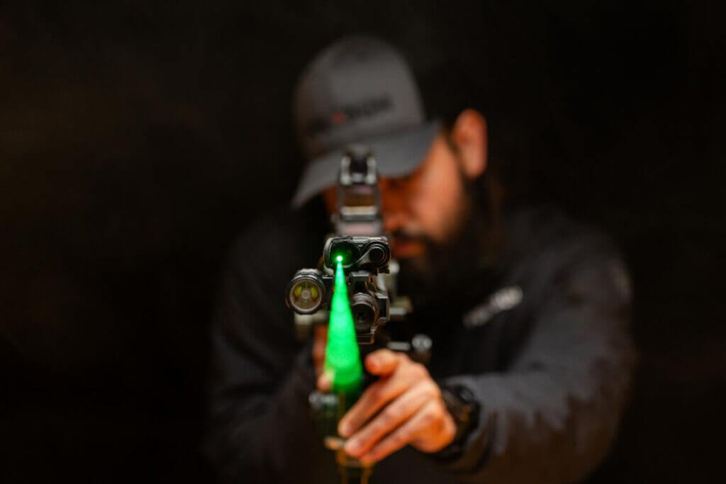 Man pointing a green laser.